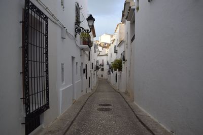 Narrow alley along buildings