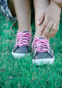 Low section of woman legs on grass