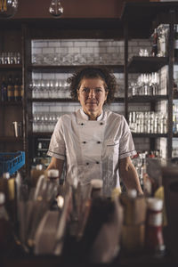 Portrait of female chef in commercial kitchen