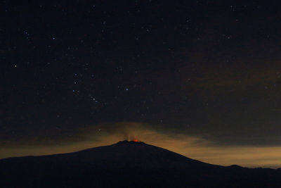 Countryside landscape against starry sky