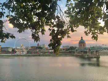 View of buildings at waterfront against sky