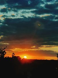 Scenic view of dramatic sky during sunset