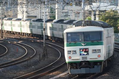 Train on railroad tracks in city