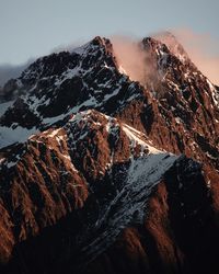 Aerial view of volcanic mountain against sky