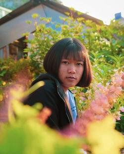 Portrait of happy girl with plants