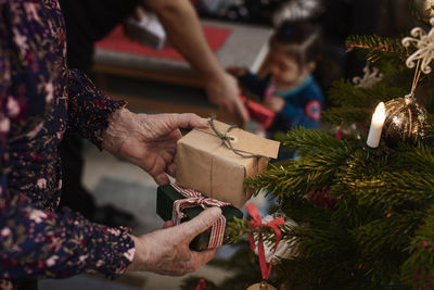 Woman's hands holding christmas presents