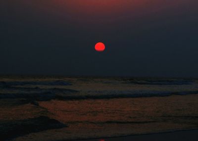 Scenic view of sea against sky at night