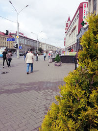 People walking on street in city