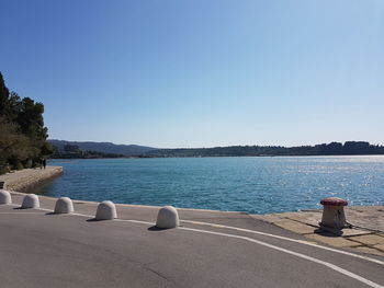 Scenic view of sea against clear blue sky