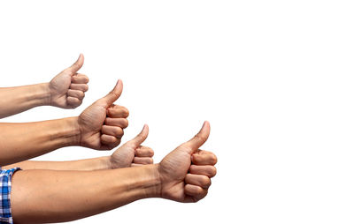 Low angle view of human hand against white background