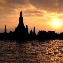 Silhouette of city at sunset