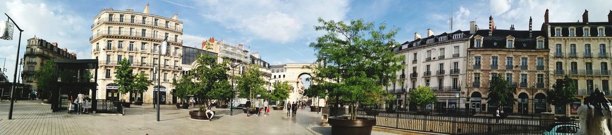 Panoramic shot of buildings in town against sky