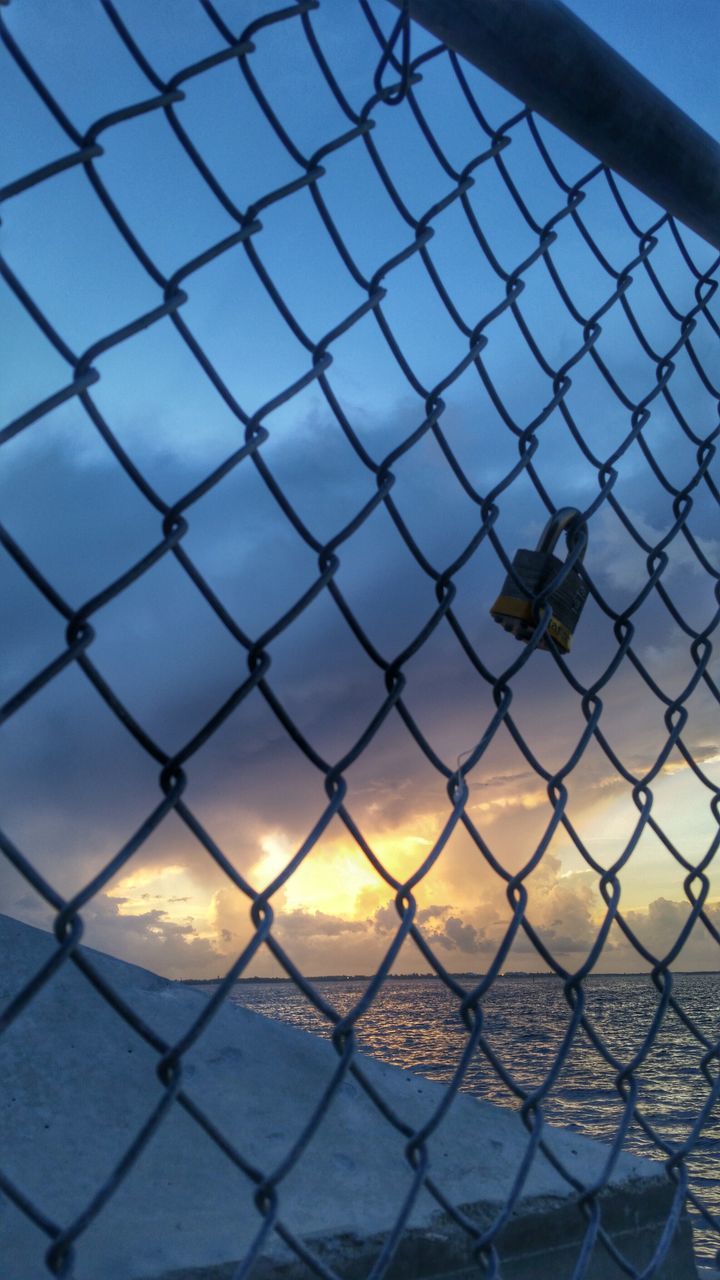 chainlink fence, fence, protection, safety, security, metal, sky, focus on foreground, full frame, backgrounds, pattern, outdoors, metallic, no people, day, close-up, sunset, sea, barbed wire, nature