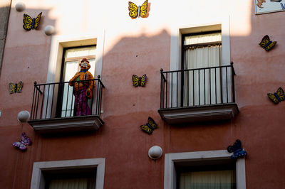 Low angle view of potted plant on building