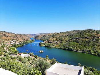 High angle view of lake against clear blue sky