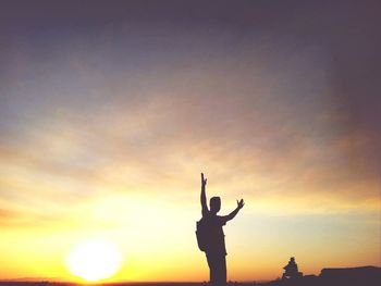 Woman looking at sunset