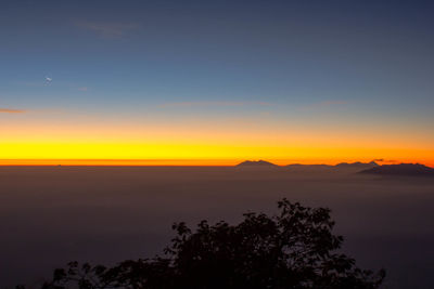 Scenic view of silhouette landscape against sky during sunset