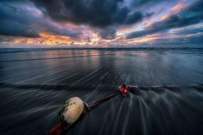 Scenic view of sea against sky at sunset