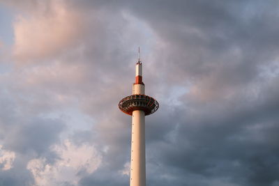 Low angle view of street light against cloudy sky