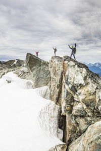 Low angle view of rocks on mountain against sky