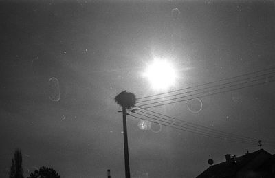 Low angle view of silhouette street light against sky