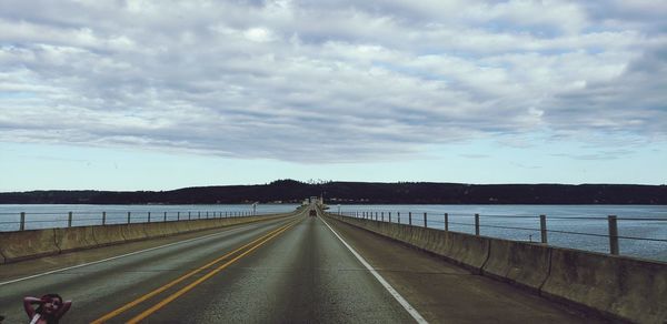 View of road against cloudy sky