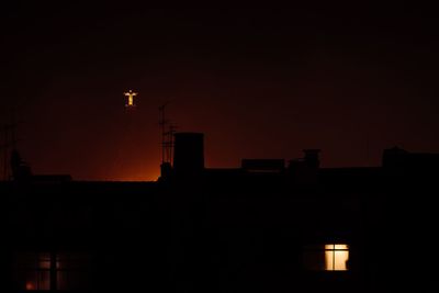 Low angle view of illuminated buildings at night