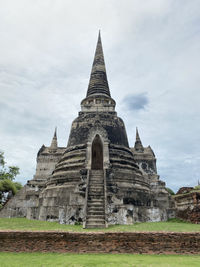 View of temple building against cloudy sky