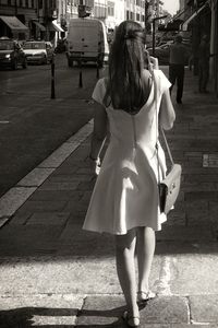 Rear view of woman standing in park