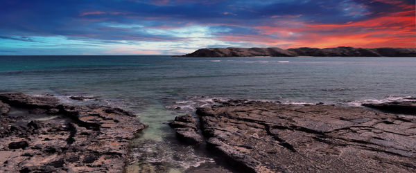 Scenic view of sea against sky during sunset