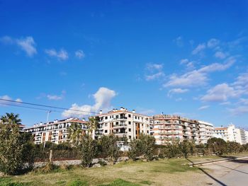 Low angle view of buildings against blue sky