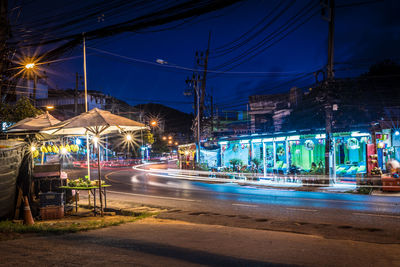 Light trails on city street at night