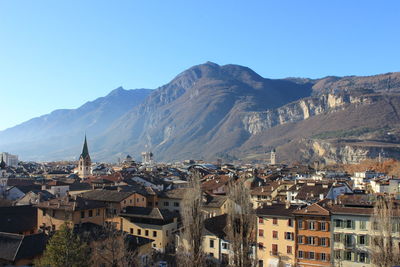 View of cityscape against mountain landscape