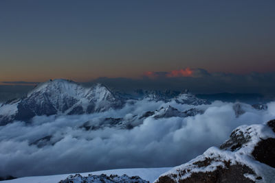 Scenic view of snow covered landscape against sky