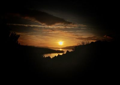 Scenic view of silhouette landscape against sky during sunset