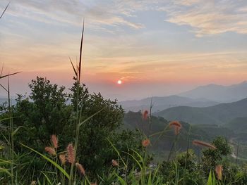 Scenic view of mountains against sky during sunset