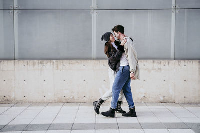 Full length of young man photographing