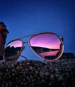 Low angle view of sunglasses against sky