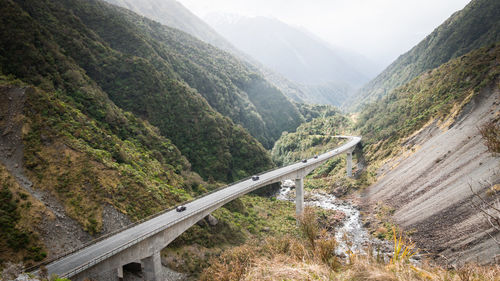 High angle view of road amidst mountains