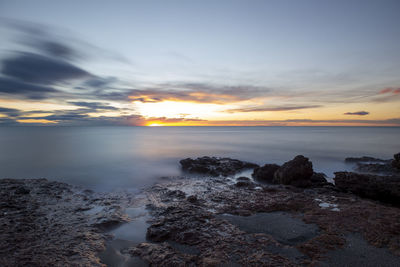 Scenic view of sea against sky during sunset