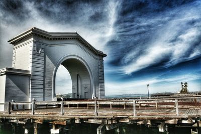 Built structure against cloudy sky