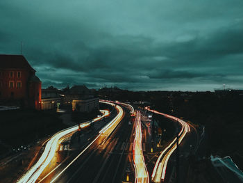 High angle view of light trails on road at night