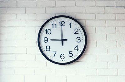 Close-up of clock on wall