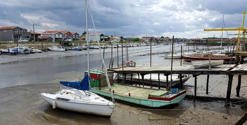 Boats moored at harbor