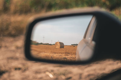 Reflection of sky on side-view mirror