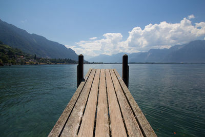 Pier over lake against sky