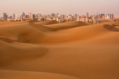 Scenic view of desert against sky in city