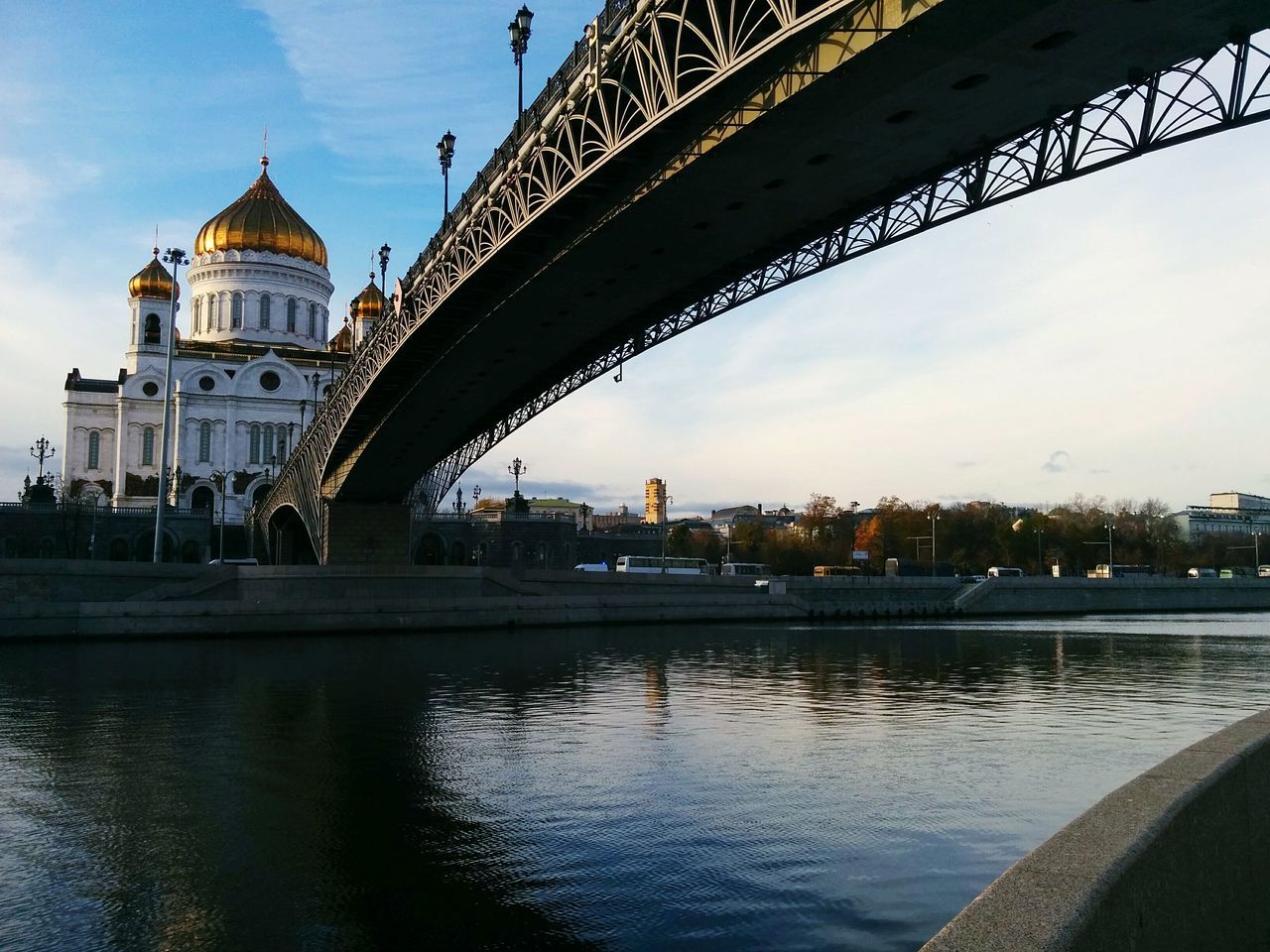 architecture, built structure, building exterior, water, river, bridge - man made structure, connection, city, sky, famous place, travel destinations, capital cities, bridge, waterfront, cloud - sky, international landmark, arch bridge, reflection, canal, tourism