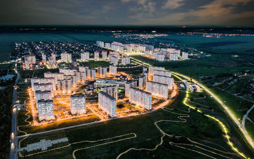 High angle view of road by buildings in city against sky