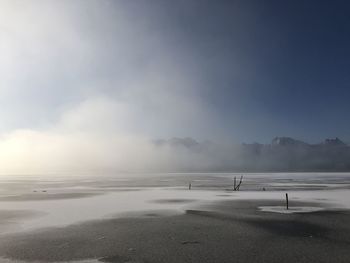 Scenic view of sea against sky during winter